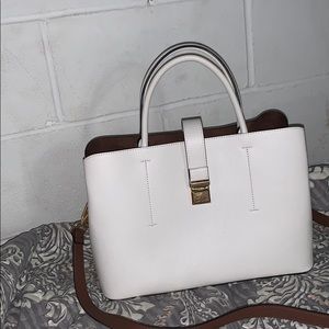 A brand new Michel Kors black bag.And a new purse